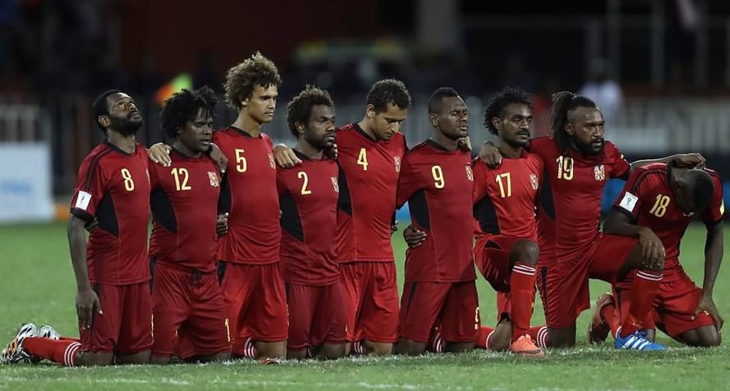 PNG players on edge during the penalty shootout.