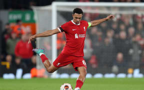 Trent Alexander-Arnold of Liverpool plays a long pass