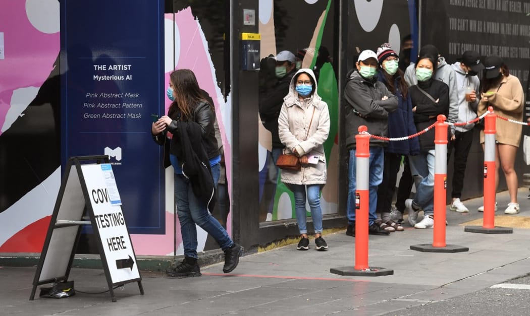 People queue at a Covid-19 coronavirus testing station in Melbourne on August 12, 2021 as five million people in Australia's second-largest city will remain under stay-at-home orders for at least another week.