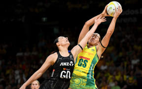 Sophie Garbin of Australia competes for possession with Karin Burger of New Zealand during the second test match of the Constellation Cup series between the Australian Diamonds and the New Zealand Silver Ferns.