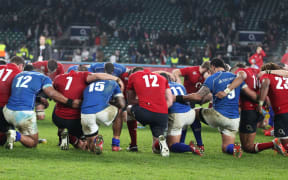 Manu Samoa and England players join for a prayer post-match.
