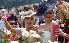 Racegoers at 156th Melbourne Cup last year.