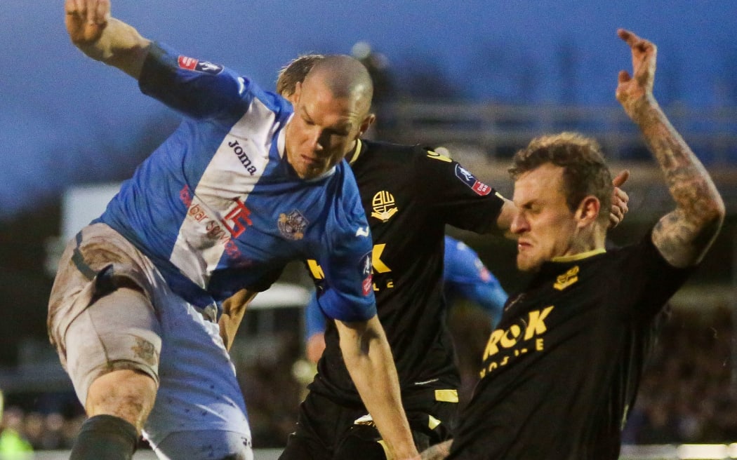 FA Cup 3rd Round 2016 - Eastleigh FC v Bolton Wanderers: Dean Moxey tackles James Constable.