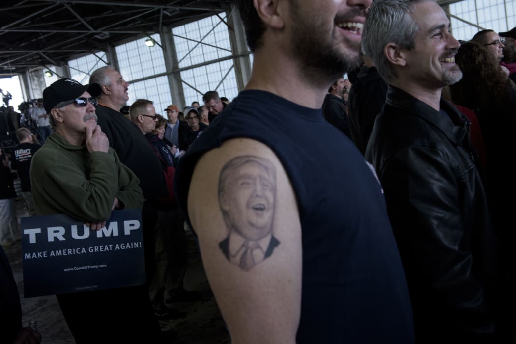 A tattoo of US Republican presidential hopeful Donald Trump on a supporter's arm.