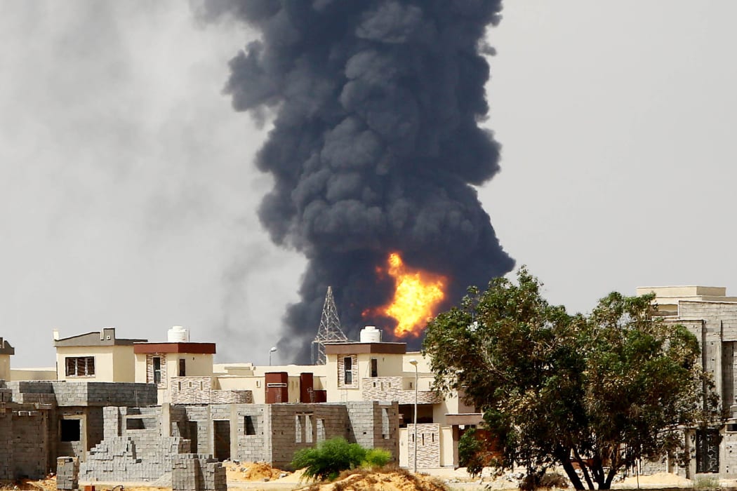 The government has urged residents living within 5km of the blaze in Tripoli to evacuate their homes.
