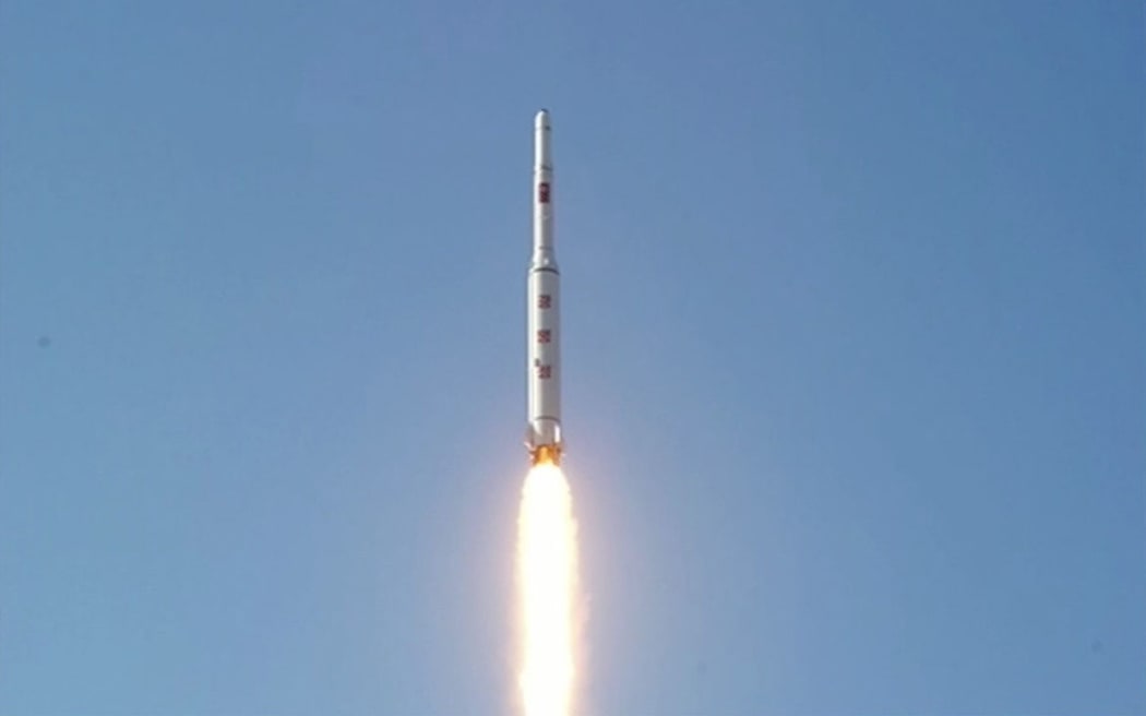 A picture taken from North Korean TV and released by South Korean news agency Yonhap showing North Korea's rocket launch of earth observation satellite Kwangmyongsong-4.