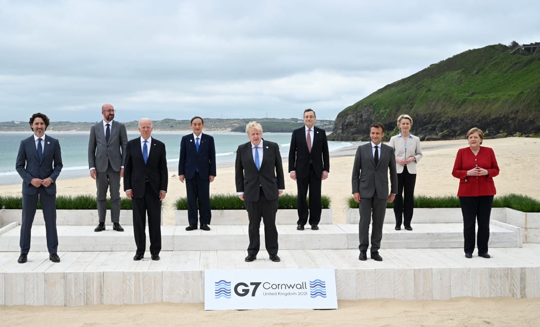 Justin Trudeau,  Charles Michel, Joe Biden, Japan's PM  Yoshihide Suga, Boris Johnson, Italy's PM Mario Draghi, France's President Emmanuel Macron, Ursula von der Leyen and Germany's Chancellor Angela Merkel  at the  G7 summit in Cornwall on June 11, 2021.