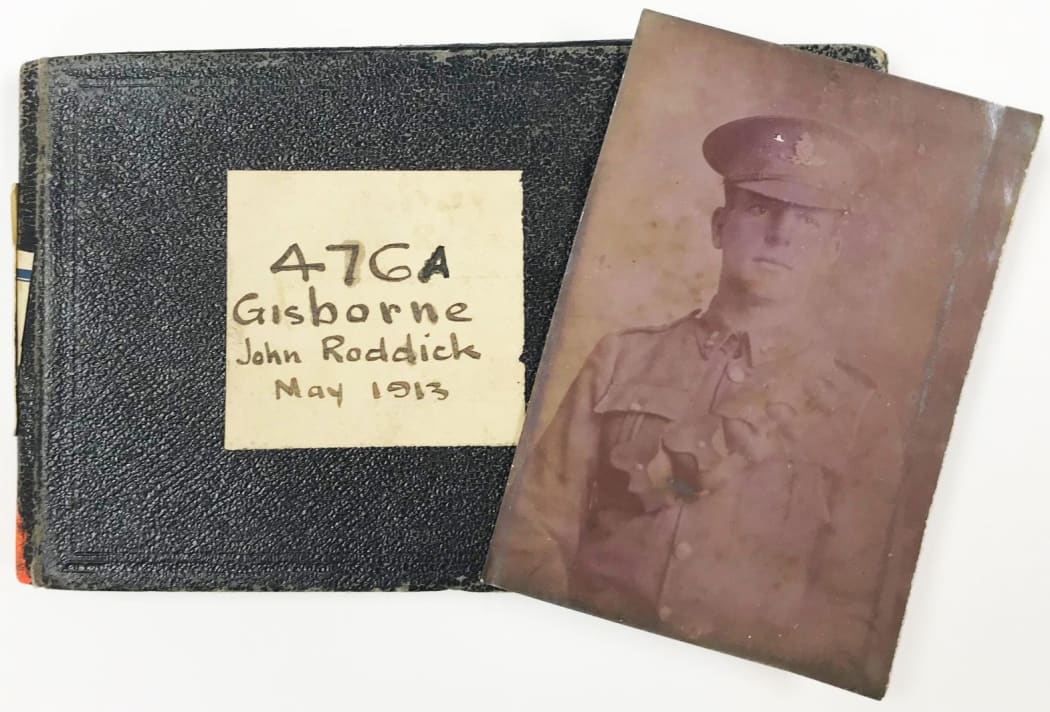Surveyor John Roddick's notebook from 1913 included a photo of an unidentified soldier.