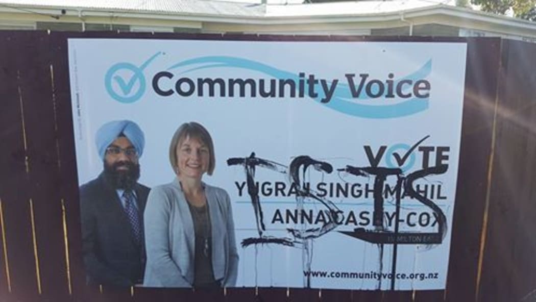 The billboard showing Yugraj Singh Mahil and another candidate Anna Casey-Cox which was defaced and has now been removed.