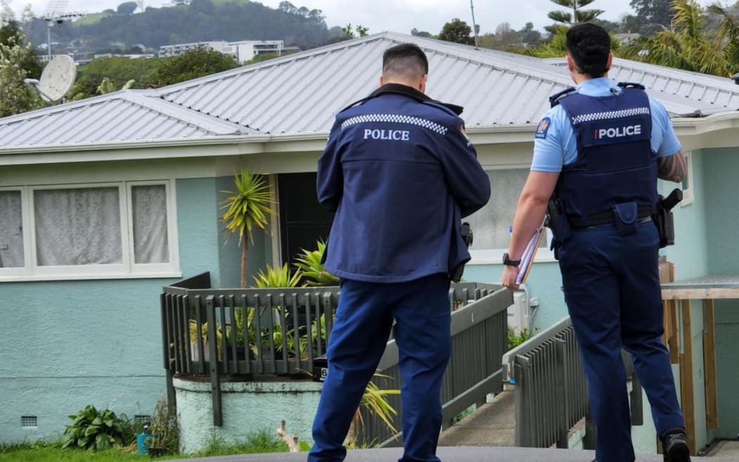 Police guard a house on Tuarangi Rd following a fatal shooting in September 2024.