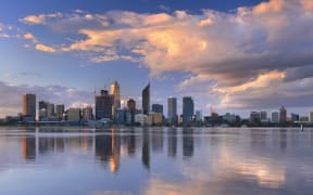 The skyline of Perth, Western Australia at sunset. Photographed from across the Swan River.