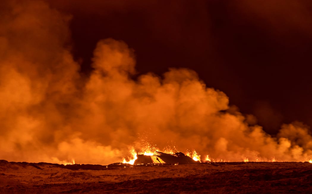 A volcano spews lava and smoke as it erupts in Grindavik, Iceland, December 18, 2023. (Photo by Snorri Thor/NurPhoto) (Photo by Snorri Thor / NurPhoto / NurPhoto via AFP)