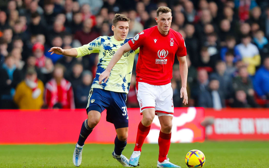Chris Wood of Nottingham Forest holds off Max Wober of Leeds United