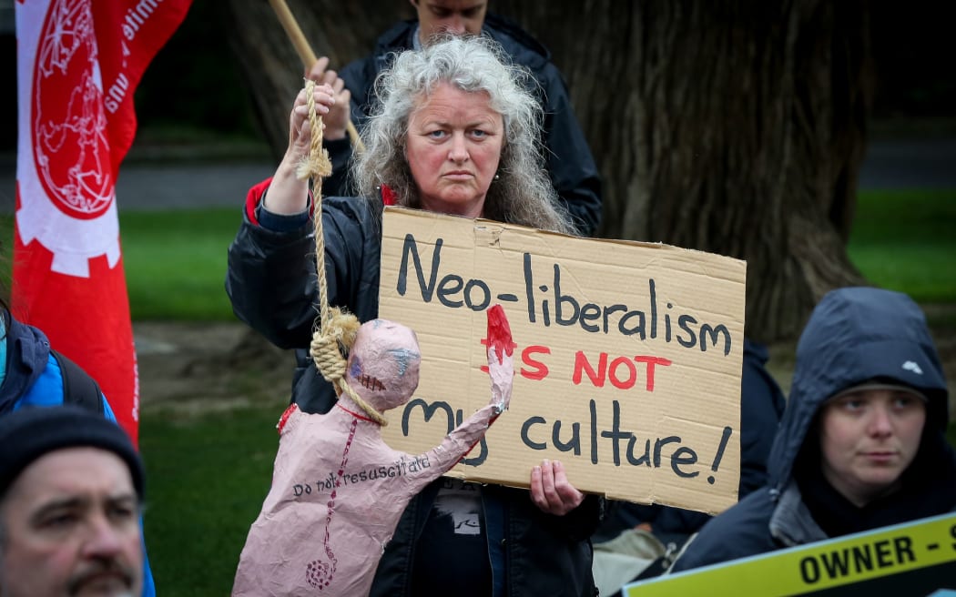 Housing protester outside the Beehive.