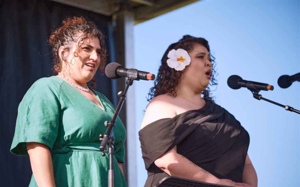 From left: singers Michaela Cadwgan and Katherine Winitana performing in Opera in the Park 2026.