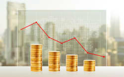 Money loss, Business concept. Gold coin stacks. Finance down with world map and cityscape background.