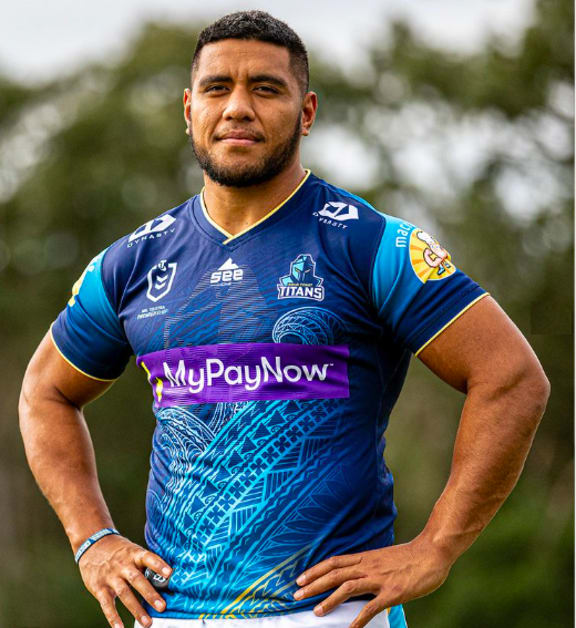 The NRL Gold Coast Titans Kalifa Faifai Loa wearing one of the jerseys they will be auctioning-off this Saturday with all proceeds being donated to Tonga relief funds. 14 June 2022