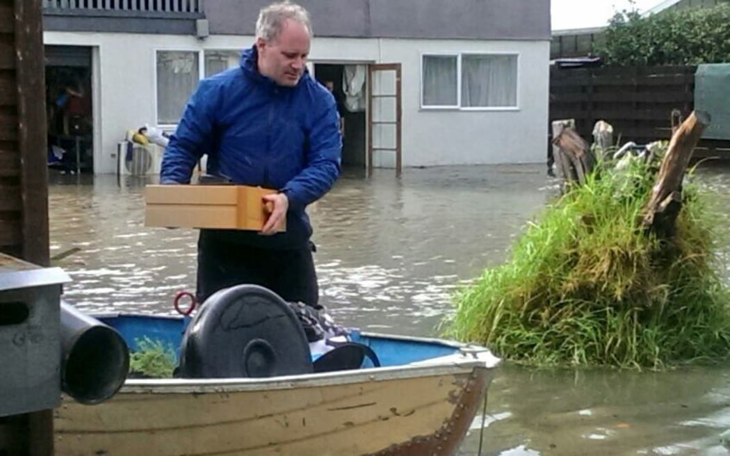 Paraparaumu resident Justin Patterson moves his furniture.