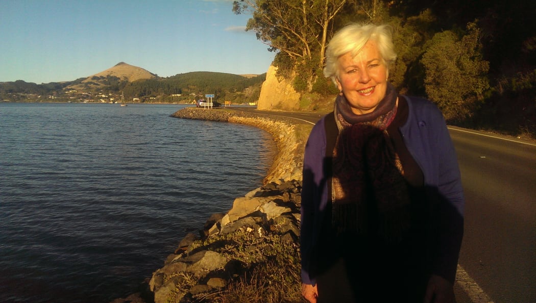 Christine Carey at Broad Bay, one of the narrow road sections to be widened.