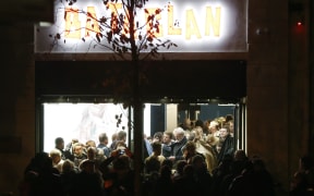 People leave the Bataclan concert hall in Paris on November 12, 2016, after the reopening concert by British musician Sting to mark the first anniversary of the November 13 Paris attacks.