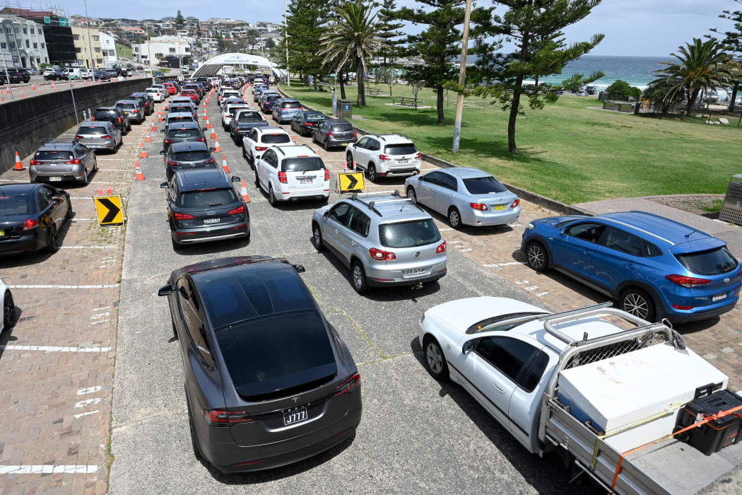 Residents queue up inside their cars for PCR tests at the St Vincent's Bondi Beach Covid-19 drive through testing clinic.