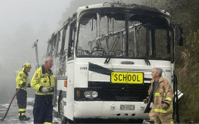Emergency services have been attending a school bus fire near Leigh on 13 February on Pakiri Road just before 8.30am.
The bus has been extensively damaged by fire. Four children were on the bus at the time.