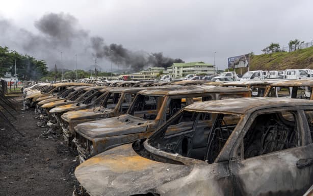 FILE - Burnt cars are lined up after unrest in Noumea, New Caledonia, on May 15, 2024. Global nickel prices have soared since deadly violence erupted in the French Pacific territory of New Caledonia. (AP Photo/Nicolas Job, File)