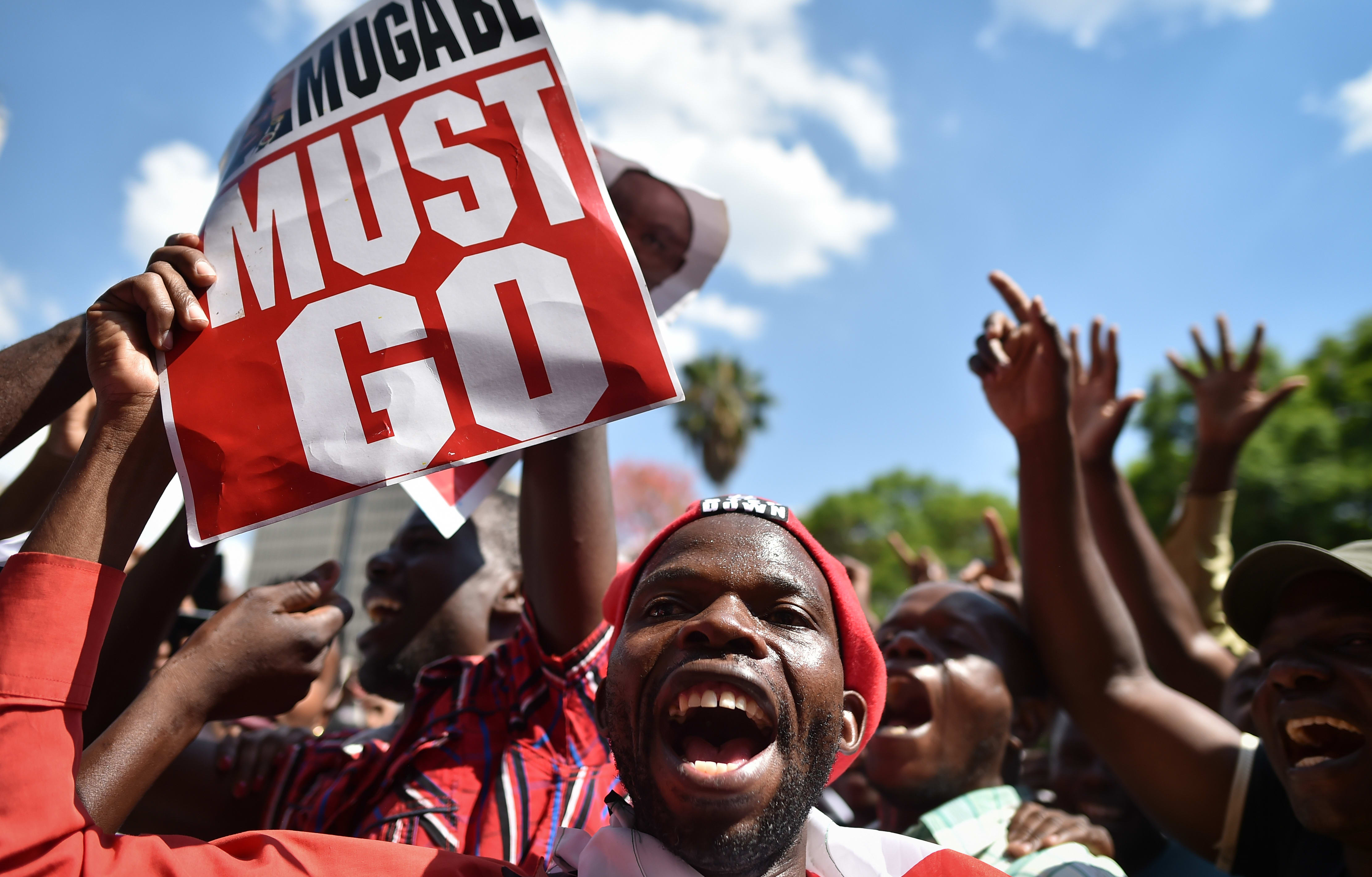Demonstrators rallied in Harare as impeachment proceedings against Robert Mugabe began in Parliament.