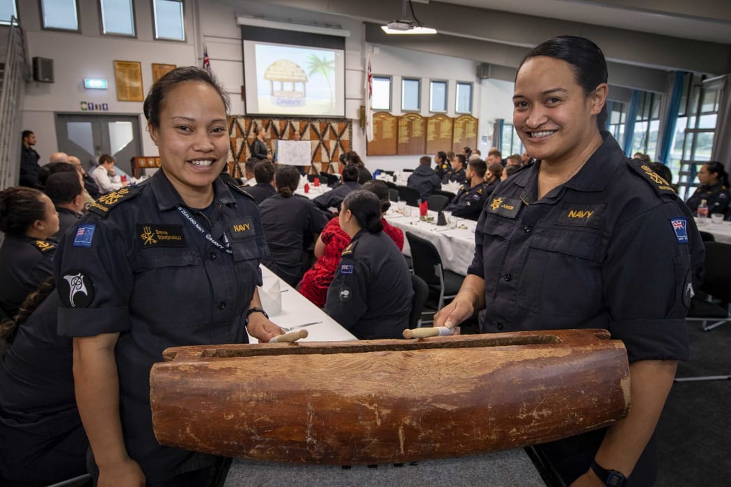 Petty Officers Emma Songivalu, left, and Junior Pahulu beat a drum at the first Royal New Zealand Navy Pacific Island Community Group forum at Devonport Naval Base.