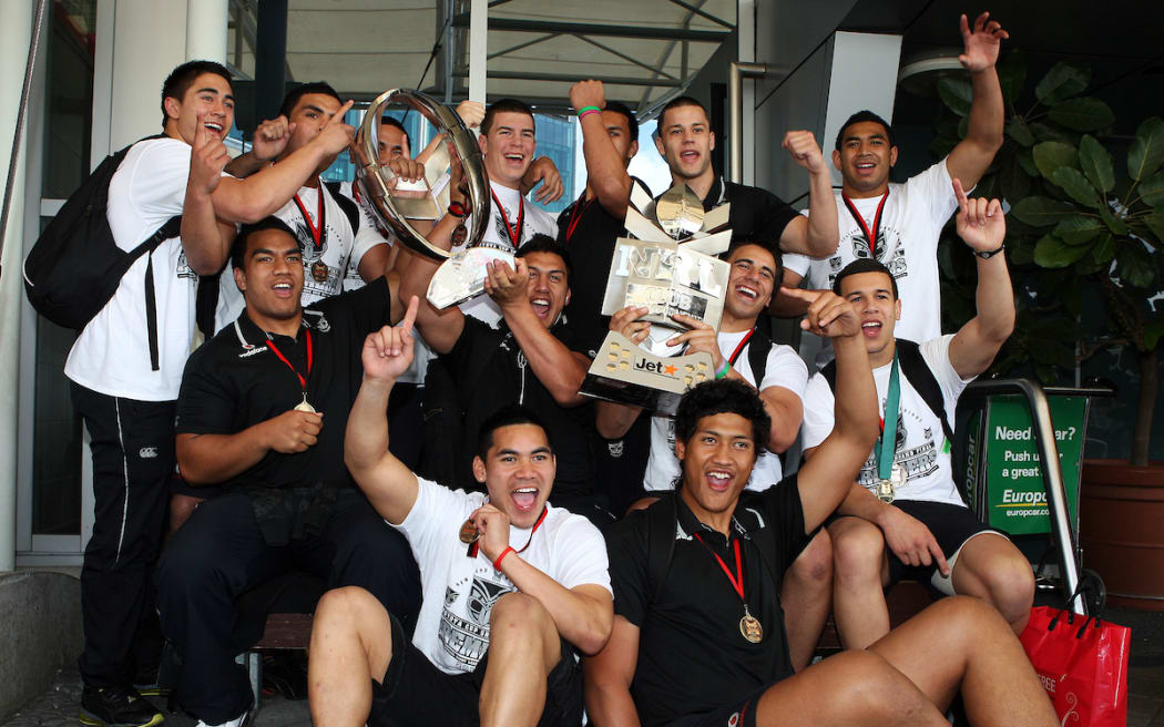 Junior Warriors arrive home with the Toyota Cup trophy and the Club Championship trophy in 2010.