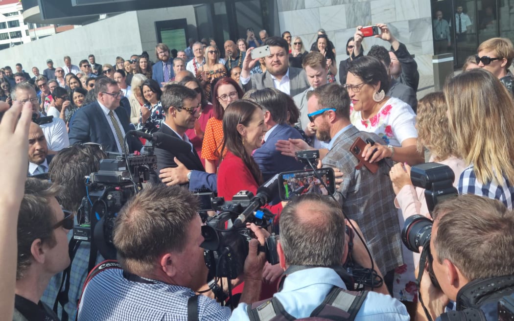 Jacinda Ardern exits Parliament for the final time as prime minister of New Zealand, greeted by fellow MPs, staff and onlookers.