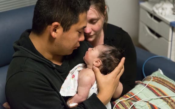 Kazu and Ruth Toyoshima with baby Ellie.
