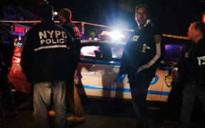 NEW YORK, NEW YORK - JUNE 03: Police gather at the scene where two New York City police officers were shot in a confrontation late Wednesday evening in Brooklyn on June 03, 2020 in New York City.