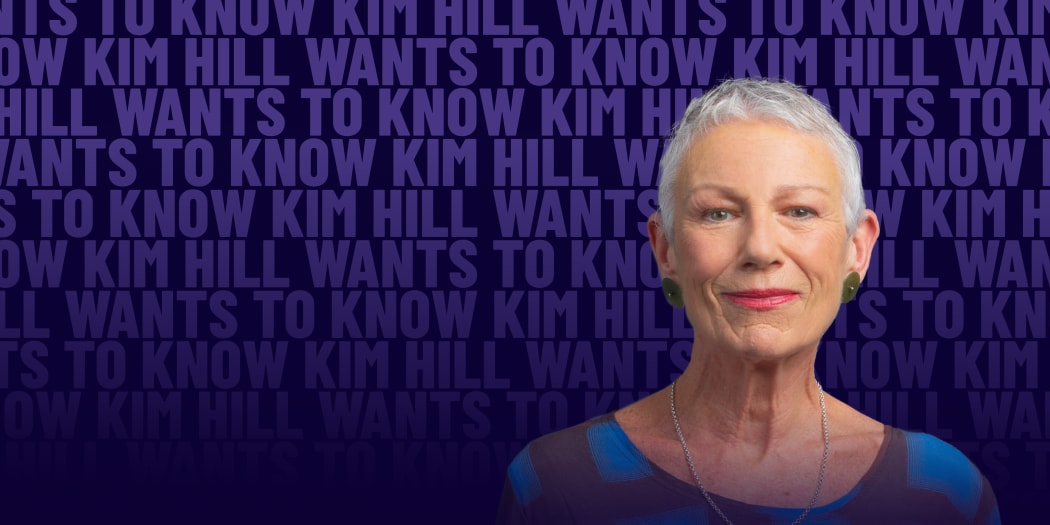 A woman with short grey hair half-smiles in front of a background of faint repeating text reading "Kim Hill Wants to Know"
