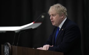 Britain's Prime Minister Boris Johnson makes a speech on immigration, at Lydd Airport on 14 April 2022. He said the navy would take over patrolling the Chanel for migrants trying to cross from France, announcing a plan to send those who made the crossing to Rwanda.