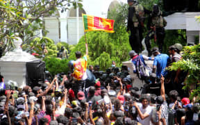Demonstrators outside the office of Sri Lanka's prime minister in Colombo on 13 July, 2022.