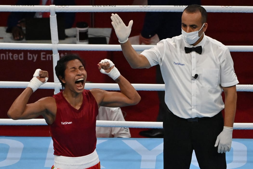 India's Lovlina Borgohain celebrates after winning against Chinese Taipei's Nien-Chin Chen in the women's welter quarter-final boxing.