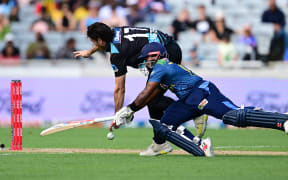 Ben Lister and Charith Asalanka.
New Zealand Black Caps v Sri Lanka, 1st Twenty20 International cricket match at Eden Park in Auckland, New Zealand. Sunday 2 April 2023. © Photo: Andrew Cornaga / www.photosport.nz