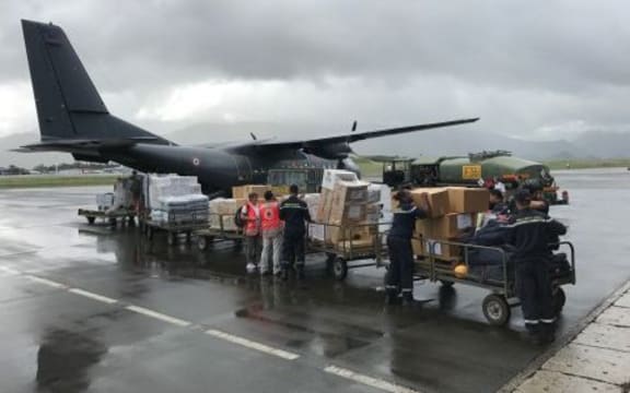 A French military plane is loaded with supplies bound for the cyclone-hit New Caledonia island of Lifou.