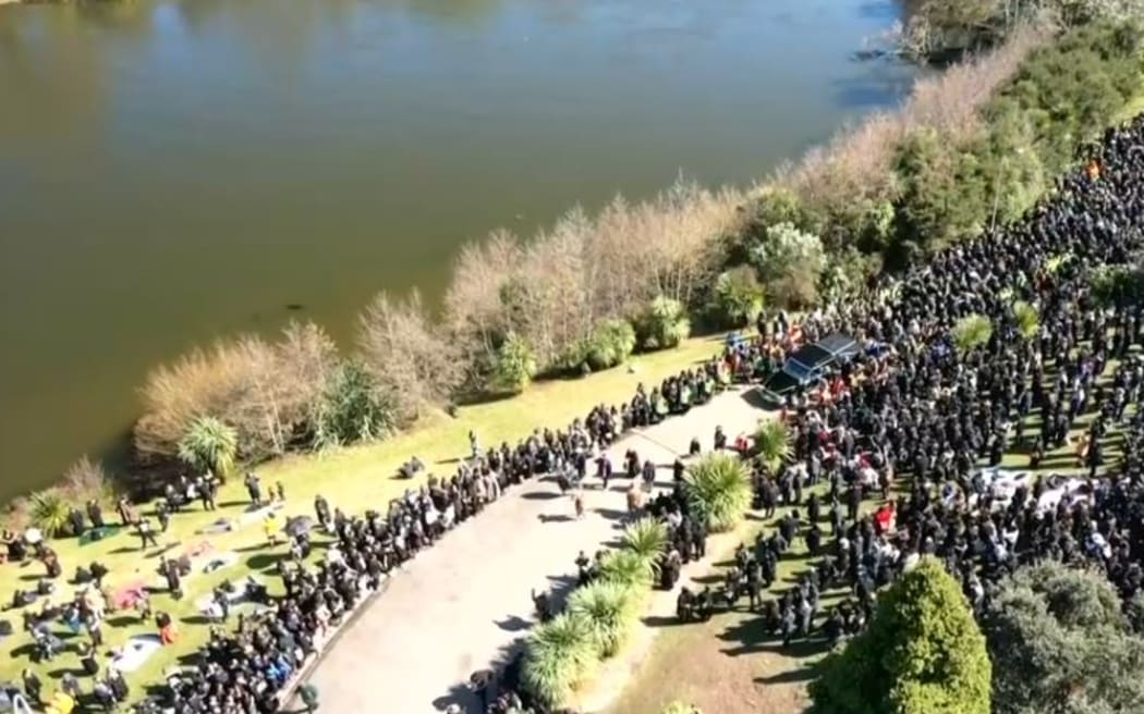 Kiingi Tuheitia Pootatau Te Wherowhero VII's body is being taken to the waka which will carry him on the Waikato River towards his his final resting place at Taupiri Maunga.