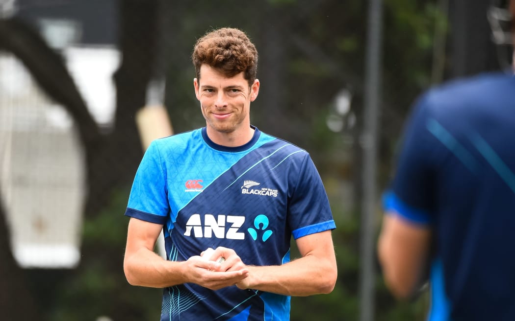Mitchell Santner gets ready to bowl in the nets during New Zealand Blackcaps training