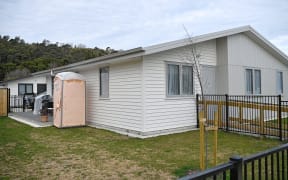 A portaloo is seen outside a newly-built Kāinga Ora home in Gisborne after construction debris was discovered in wastewater pipes.