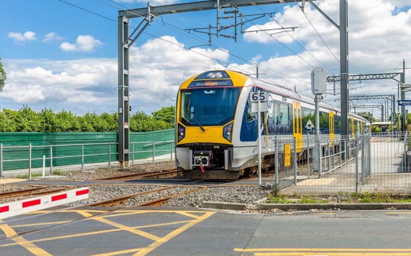 A train approaches a level crossing.