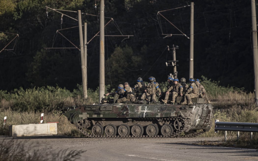 KHARKIV, UKRAINE - SEPTEMER 09: Ukrainian forces patrol after Ukrainian army took control some of the villages in Kharkiv, Ukraine on September 09, 2022. Metin Aktas / Anadolu Agency (Photo by Metin Aktas / ANADOLU AGENCY / Anadolu Agency via AFP)