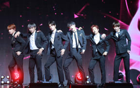 Members of South Korean boy band Astro perform during a press conference for their mini album "Dream Part.02" in Seoul, South Korea, 1 November 2017. (Photo by More forms / Imaginechina / Imaginechina via AFP)