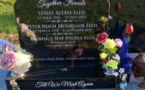 The headstone on the grave of Peter Ellis, his mother Lesley Ellis and his pet dog, Florence May Poodle Ellis