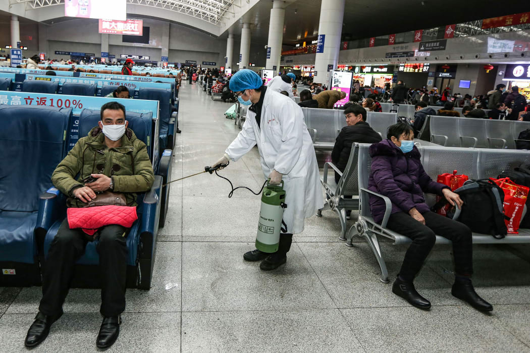 A worker disinfecting the waiting area at a railway station in Nanchang, in China's central Jiangxi province. 22 January.