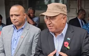 Outside the government buildings in Suva, Bainimarama, right, and Qiliho thanked their supporters and god for their prayers.