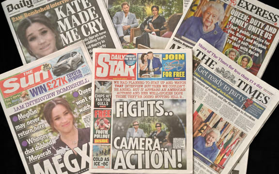 An arrangement of UK daily newspapers photographed as an illustration, shows front page headlines reporting on the story of the interview given by Meghan, Duchess of Sussex, wife of Britain's Prince Harry, Duke of Sussex, to Oprah Winfrey, which aired on US broadcaster CBS.