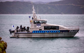 Police dive at Karaka Bay after discovering the body of a diver that went missing